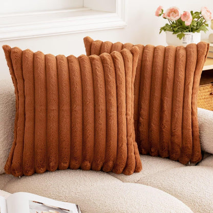 Verdelisse faux fur throw pillow covers in Rust, a pair on a boucle sofa