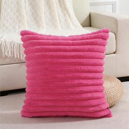 Verdelisse faux fur throw pillow cover in Hot Pink on a sofa with a white knit throw