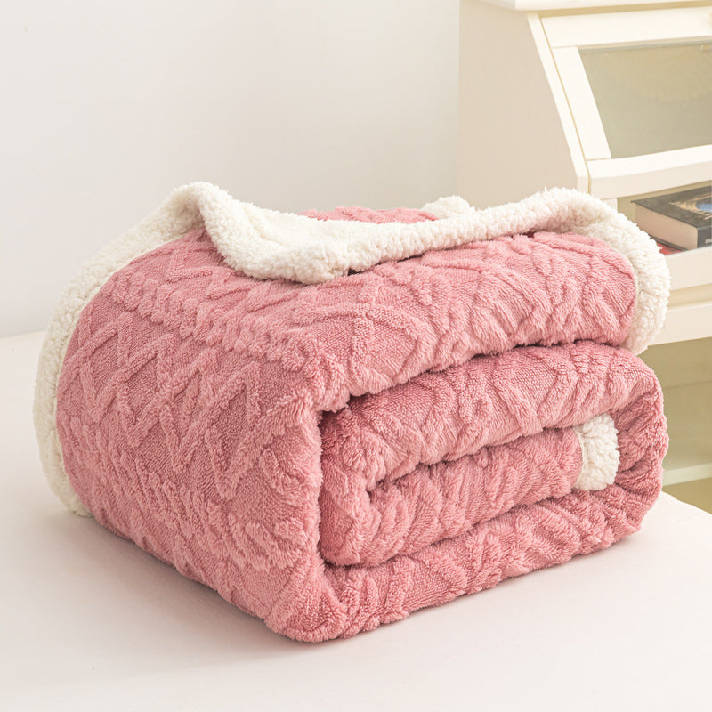 Verdelisse Double-Sided Sherpa Blanket in Pink, folded to show the knit side and white sherpa lining