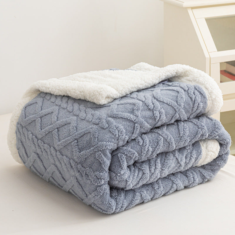 Verdelisse Double-Sided Sherpa Blanket in Blue, folded to show the knit side and white sherpa lining