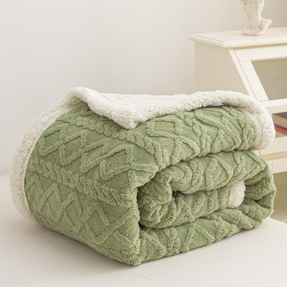 Verdelisse Double-Sided Sherpa Blanket in Green, folded to show the knit side and white sherpa lining