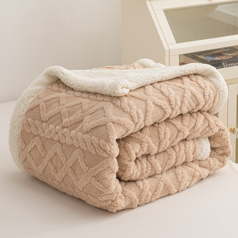 Verdelisse Double-Sided Sherpa Blanket in Taupe, folded to show the knit side and white sherpa lining