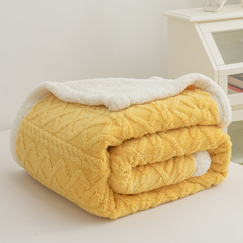 Verdelisse Double-Sided Sherpa Blanket in Yellow, folded to show the knit side and white sherpa lining