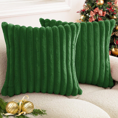 Verdelisse faux fur throw pillow covers in Emerald Green, a pair on a sofa in front of a Christmas tree