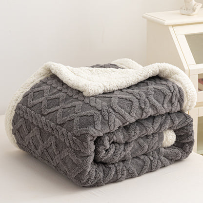 Verdelisse Double-Sided Sherpa Blanket in Gray, folded to show the knit side and white sherpa lining