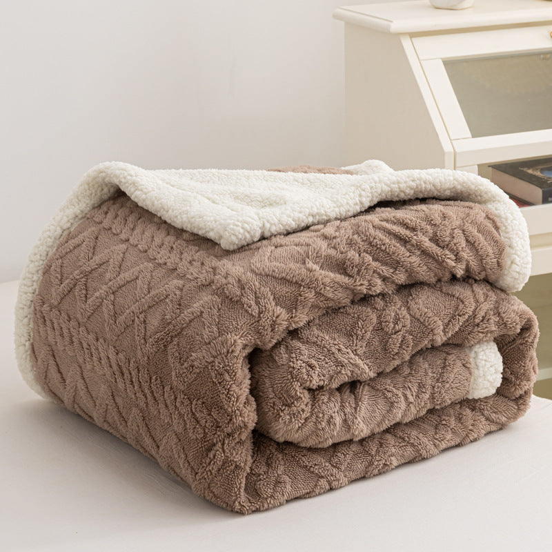 Verdelisse Double-Sided Sherpa Blanket in Brown, folded to show the knit side and white sherpa lining