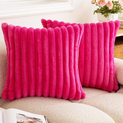Verdelisse faux fur throw pillow covers in Hot Pink, a pair on a boucle sofa