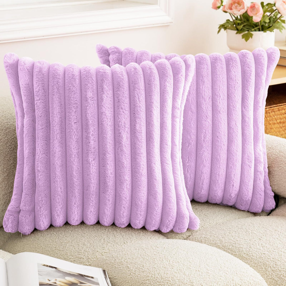 Verdelisse faux fur throw pillow covers in Lilac, a pair on a boucle sofa