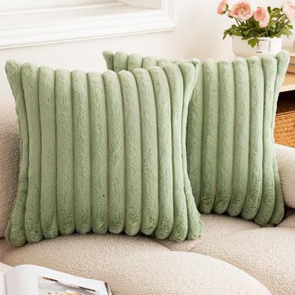 Verdelisse faux fur throw pillow covers in Sage Green, a pair on a boucle sofa
