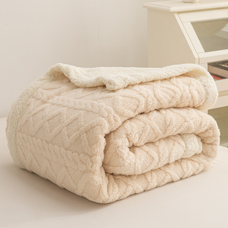 Verdelisse Double-Sided Sherpa Blanket in Cream, folded to show the knit side and white sherpa lining
