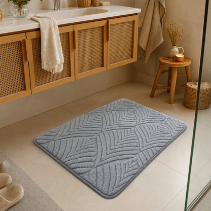 Verdelisse Non-Slip Bath Rug in Grey, lying in front of the bathroom basin