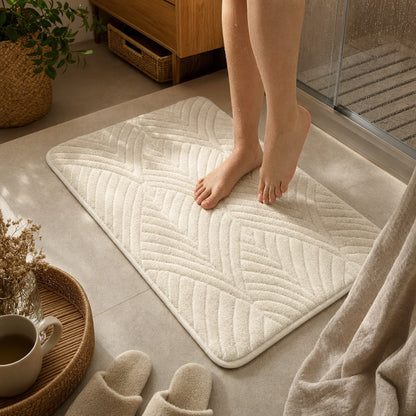 Verdelisse Non-Slip Bath Rug in White, feet stepping onto the rug after a shower