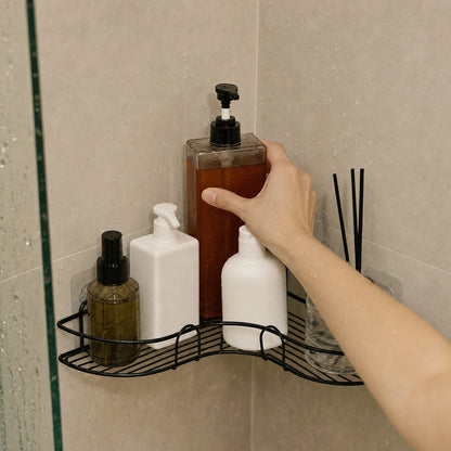 Verdelisse Wall-Mounted Bathroom Organizer in Black, hand taking a shampoo bottle in the shower