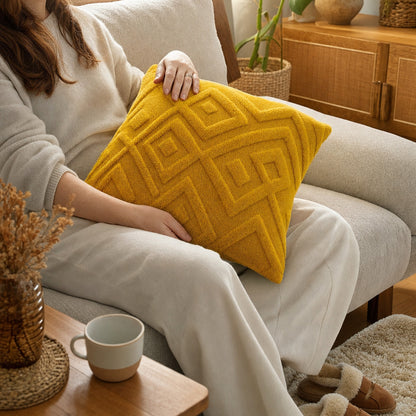 Verdelisse Boho Throw Pillow Covers in Yellow, held in a lap on the sofa