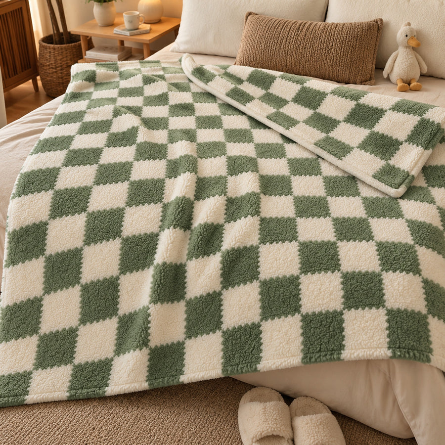 Verdelisse Checkered Fleece Throw Blanket in Green Check, spread over a bed in a cozy bedroom