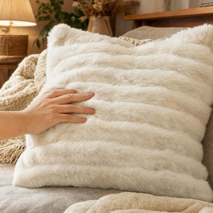 Verdelisse Faux Fur Throw Pillow Cover in White, a hand stroking the soft fur