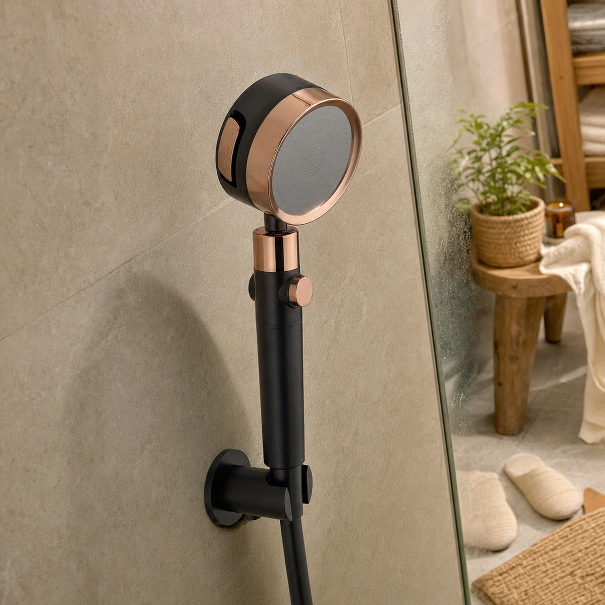 Verdelisse Filtered Showerhead in Black with rose-gold details, in a wall holder