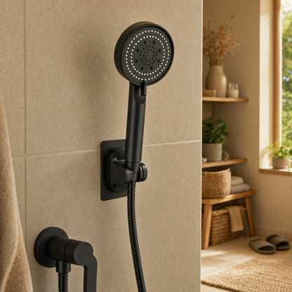 Verdelisse Black Handheld Shower Head with Hose in its adhesive wall holder on a tiled shower wall