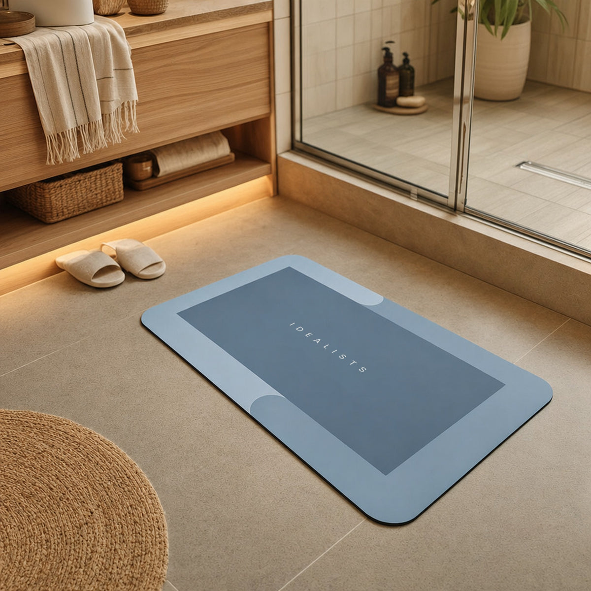 Quick Dry Bath Mat in Blue in front of a wooden vanity