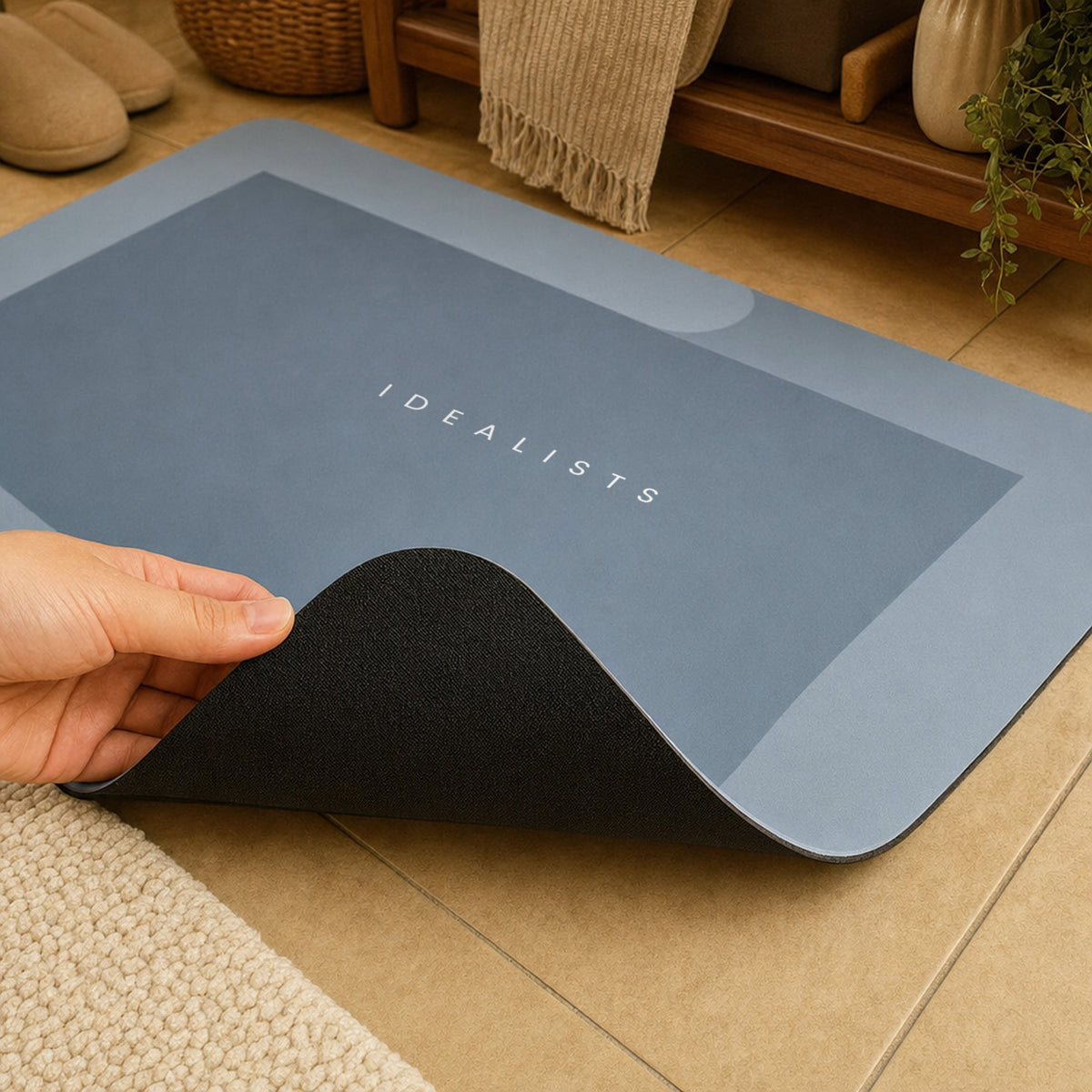 Thin Quick Dry Bath Mat in Blue with its corner lifted to show the rubber anti-slip backing