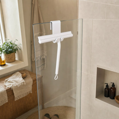Verdelisse Silicone Shower Squeegee in White, hanging on a glass shower screen in a cozy bathroom