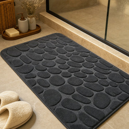 Verdelisse Stone Bath Mat in Dark Gray, close-up of the raised pebble pattern