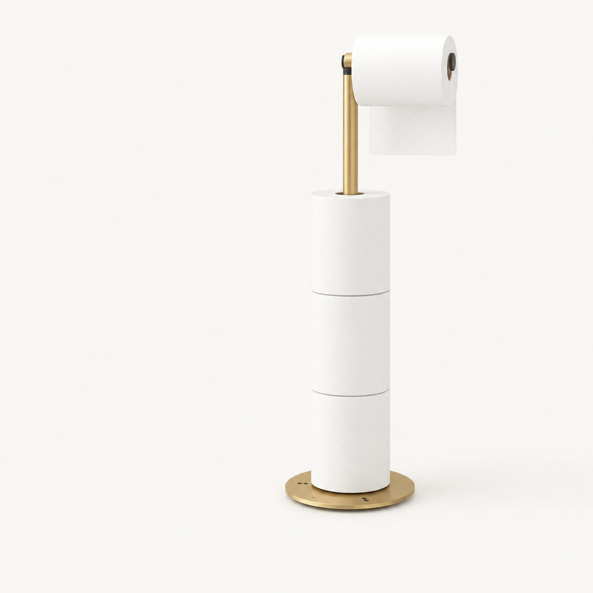 Golden Verdelisse freestanding toilet paper holder on a plain off-white studio background