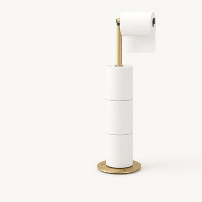Golden Verdelisse freestanding toilet paper holder on a plain off-white studio background