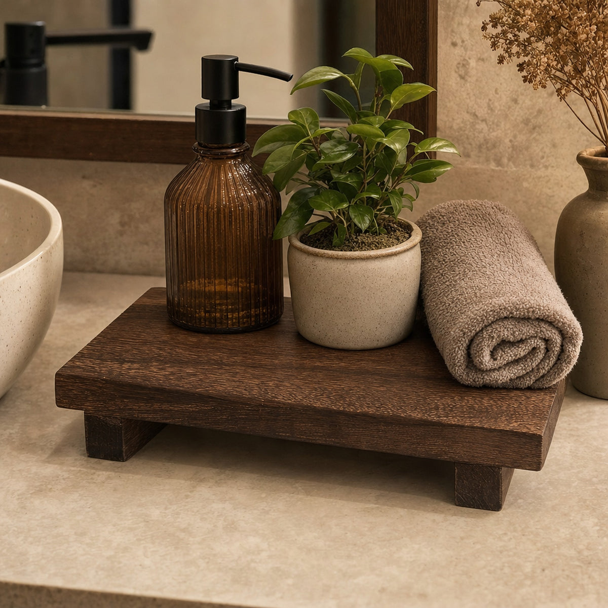 Verdelisse Wooden Bathroom Tray in Brown on a vanity with a soap dispenser, plant and rolled towel
